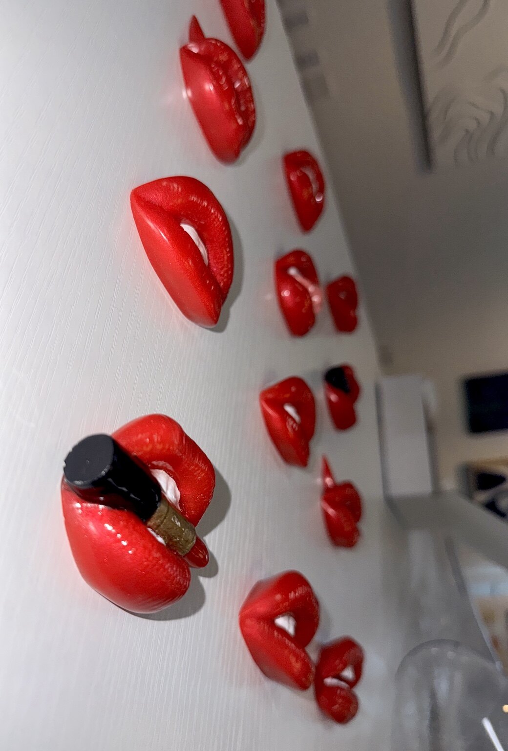 Dimensional view of a red 3D lip wall installation